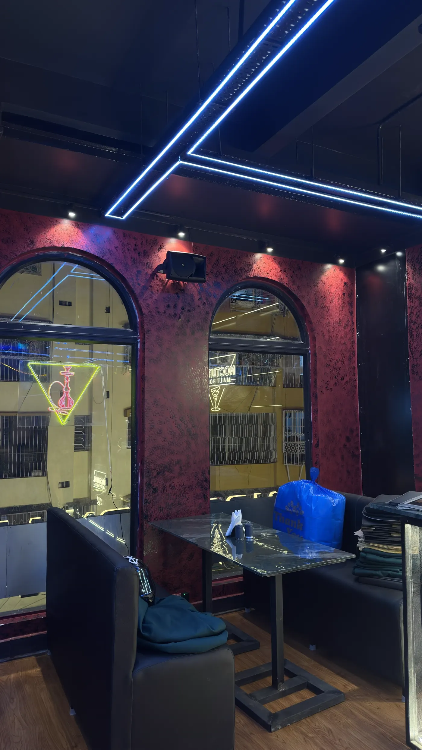 A window booth beneath an arched window